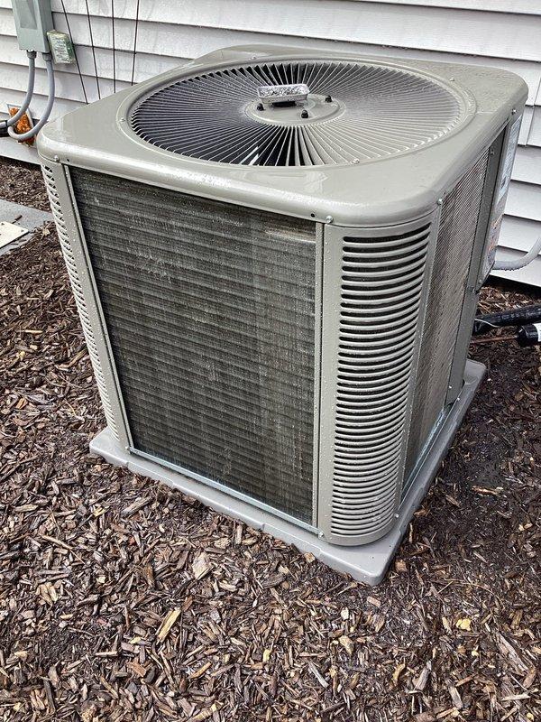 Completed planned air conditioning maintenance as part of membership agreement. Performed comprehensive inspection of outdoor condensing unit, including evaluation of fan assembly, condenser coils, and electrical components. Unit showed signs of normal outdoor exposure with dirt and debris accumulation on exterior grilles and surfaces. Verified proper operation of all mechanical and electrical systems. Documented equipment condition with photographs showing unit positioned on concrete pad with appropriate clearances. All components functioning within normal parameters at time of service.