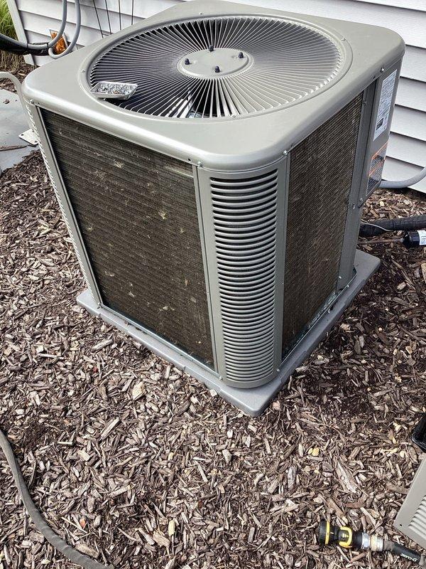 Completed planned air conditioning maintenance as part of membership agreement. Performed comprehensive inspection of outdoor condensing unit, including evaluation of fan assembly, condenser coils, and electrical components. Unit showed signs of normal outdoor exposure with dirt and debris accumulation on exterior grilles and surfaces. Verified proper operation of all mechanical and electrical systems. Documented equipment condition with photographs showing unit positioned on concrete pad with appropriate clearances. All components functioning within normal parameters at time of service.