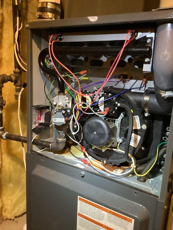 Responded to no-cool call at commercial church facility where cleaning company reported leaking at indoor coil. Upon arrival, accessed air handler unit and confirmed system operating but not cooling correctly. Inspected internal components including blower assembly, control boards, and evaporator coil section. Documented existing conditions showing moisture concerns at coil area with photographic evidence of unit interior, wiring configurations, and component layout for further diagnostic evaluation and repair recommendations.