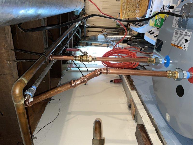 Installed 50-gallon electric water heater in basement utility area with new shut-off valve and associated plumbing connections. Completed all electrical connections to existing circuit panel, verified proper operation of heating elements, and ensured all safety labels and specifications were visible on the unit. Payment collected in full upon completion.