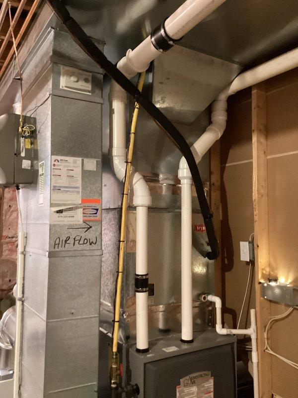 Responded to non-urgent central heating service call to address leaking exhaust vent. Removed compromised section of exhaust venting and rebuilt transition from 3-inch to 2-inch PVC pipe to ensure proper condensate drainage and exhaust flow from high-efficiency furnace. Upon completion of repairs, enrolled customer in preventive maintenance agreement covering complete HVAC system for ongoing equipment protection and performance optimization.