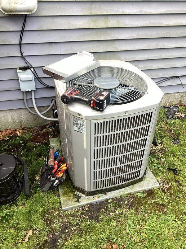 # HVAC Maintenance Completed

Performed comprehensive planned maintenance service on residential air conditioning system. Conducted full system diagnostic evaluation using calibrated manifold gauges to assess refrigerant pressures and system performance.

Completed thorough inspection of outdoor condensing unit, verifying proper operation of compressor and condenser fan motor. Measured and recorded electrical parameters including voltage at disconnect (290V/120V) and contactor (140V/120V). Evaluated compressor amp draw at 12.6A startup and 13.8A running, both within manufacturer specifications. Tested run capacitor functionality, recording 40µF rated with actual reading of 32.2µF, and measured condenser fan motor capacitor at 6µF with 5.1µF actual reading.

Inspected indoor air handler components and verified proper airflow through system. Measured return air temperature at 59°F and supply air temperature at 52°F, confirming adequate temperature split of 7°F across evaporator coil. Rec