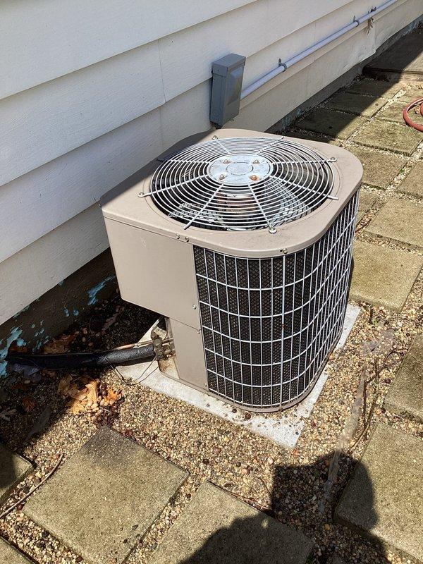 Completed scheduled air conditioning maintenance per membership agreement. Performed comprehensive system inspection of outdoor condenser unit, replaced two 16x20x1 air filters, checked electrical connections and disconnect box, verified proper airflow through condenser coils and grille assembly, and confirmed unit operation on concrete pad with adequate clearances from surrounding landscaping and structure.
