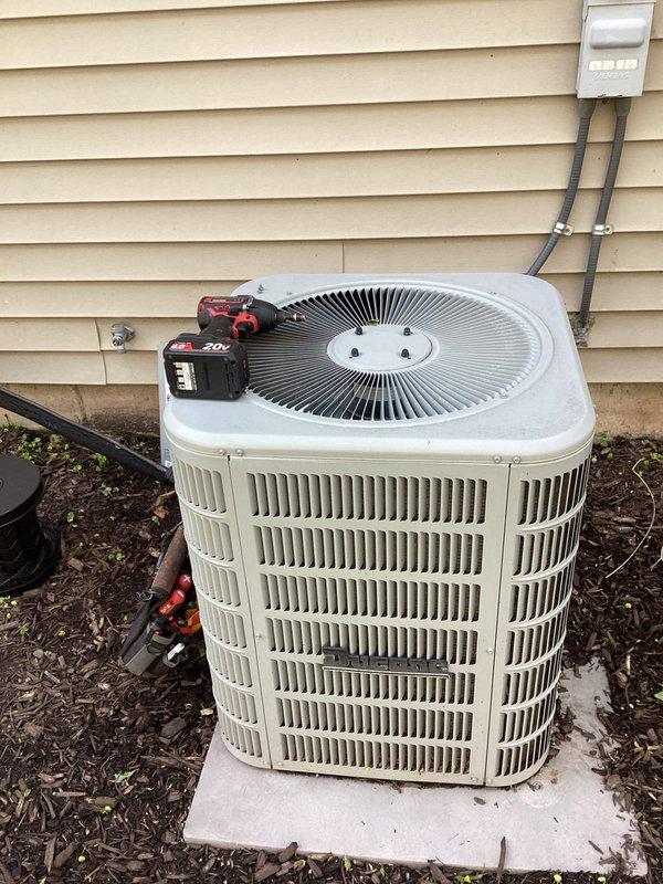 Completed scheduled air conditioning maintenance on outdoor condensing unit. Performed comprehensive system inspection including electrical connections, capacitor testing, and hard start relay evaluation. Removed access panel to inspect internal components, verified proper wiring connections at capacitor terminals, and confirmed operational status of all electrical components. Cleaned and assessed condenser unit exterior, checked refrigerant lines, and ensured proper airflow through coil assembly. Unit operating within normal parameters upon completion of maintenance service.