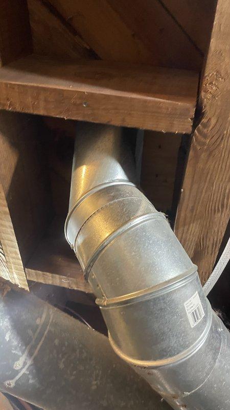 Responded to callback for loose register boot following recent HVAC installation. Upon inspection, found register boot had separated from ductwork connection in attic space. Documented existing conditions with photos showing boot disconnection and surrounding ductwork installation. Unable to definitively determine if issue was directly related to original installation work or resulted from other factors. Secured and reconnected register boot to ensure proper airflow and system operation.
