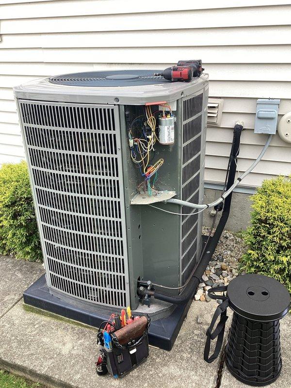 Completed scheduled air conditioning maintenance on residential outdoor condensing unit. Performed comprehensive system inspection including capacitor testing, electrical connections verification, and internal component assessment. All wiring connections were secure with proper color coding observed, capacitor tested within normal operating parameters, and unit operating efficiently with no deficiencies noted.