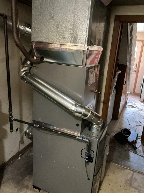 Completed full HVAC system installation including Lennox ML180UH090E48BK furnace, ML13KC1-036 condenser unit, CK40CT-30/36B cased coil, 1610 media filter, and 36x36x3 condenser pad in residential utility closet. Rotated furnace orientation to face away from wall per site requirements, installed all ductwork connections, gas supply lines, and condensate piping. Verified all system components per manufacturer installation checklist, confirmed proper refrigerant controls, integrated control systems, and exhaust venting prior to startup.