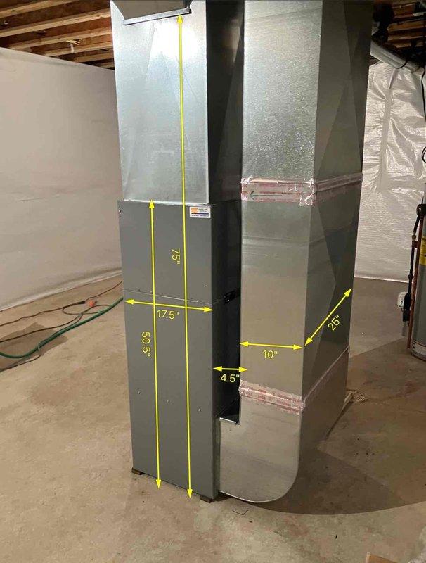Conducted on-site assessment for HVAC system upgrade from standard 1-inch filter to media filter system to improve filter accessibility. Documented existing furnace and ductwork configuration in basement mechanical room, taking detailed measurements of vertical supply ducts and clearances for proper media filter cabinet sizing and installation planning. Photographed current equipment layout including furnace unit, ductwork dimensions, and available space for system modifications to prepare comprehensive replacement estimate.