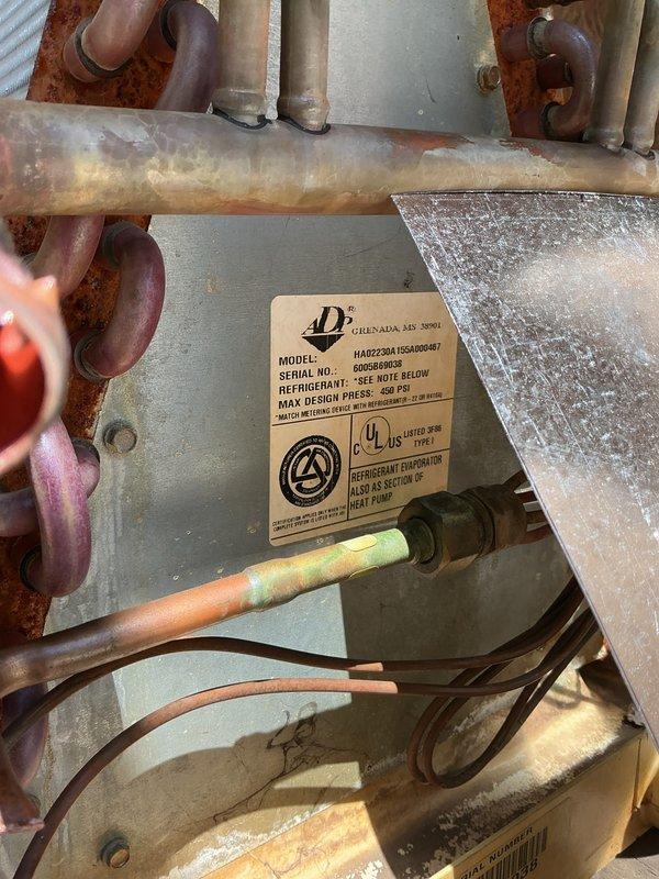 Completed full air conditioning system installation including Lennox ML13KC1-030 condenser unit, CK40CT-30B cased evaporator coil, T4 thermostat, and condensate pump with tubing. Evaporator coil was removed from case to facilitate proper installation in basement utility area. All refrigerant lines were connected and insulated with black foam, PVC condensate drain lines were routed and secured, and electrical connections were completed including proper conduit installation. System was charged with refrigerant per manufacturer specifications, tested for proper operation, and thermostat was programmed and verified functional. All components are operating within normal parameters.