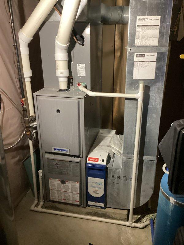 Completed planned single maintenance on Tempstar furnace and outdoor condensing unit. Accessed property using lockbox, performed standard system inspection, replaced air filter, and verified proper operation of both heating and cooling equipment. Documented equipment condition with photos showing indoor air handler with PVC condensate drainage and outdoor condenser unit with refrigerant lines and electrical disconnect in good working order.