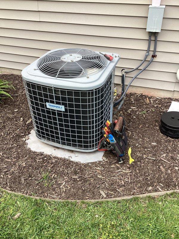 Completed planned single maintenance on Tempstar furnace and outdoor condensing unit. Accessed property using lockbox, performed standard system inspection, replaced air filter, and verified proper operation of both heating and cooling equipment. Documented equipment condition with photos showing indoor air handler with PVC condensate drainage and outdoor condenser unit with refrigerant lines and electrical disconnect in good working order.