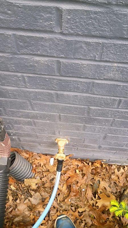 Responded to basement flooding caused by leaking hose bib fixture. Upon arrival, water supply was already shut off with minimal standing water remaining in affected areas. Inspected exterior hose bib connection and interior copper piping running through basement joists, identifying leak source at hose fixture that had been in use for pool filling operations. Documented existing copper pipe oxidation and connection points. Assessed water damage to basement area and confirmed leak isolation. Provided recommendations for hose bib repair or replacement to prevent future flooding incidents.