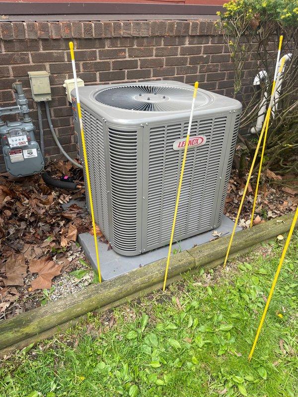 Responded to service call for Lennox outdoor condensing unit that was physically displaced after being struck by fire truck equipment. Upon arrival, found unit had been moved off its original position on concrete pad. Inspected unit for structural damage, refrigerant line integrity, electrical connections, and proper leveling. Repositioned condensing unit on pad using temporary support stakes to ensure proper drainage and airflow clearance from building structure. Verified electrical disconnect box connections remained secure and undamaged. Unit operational at time of service with no immediate refrigerant leaks detected or electrical issues observed.