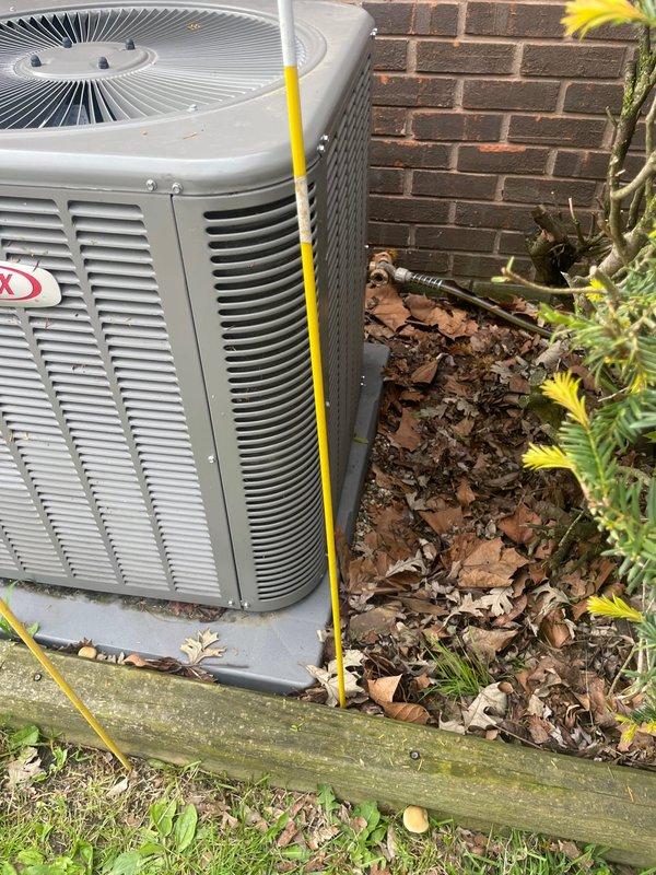 Responded to service call for Lennox outdoor condensing unit that was physically displaced after being struck by fire truck equipment. Upon arrival, found unit had been moved off its original position on concrete pad. Inspected unit for structural damage, refrigerant line integrity, electrical connections, and proper leveling. Repositioned condensing unit on pad using temporary support stakes to ensure proper drainage and airflow clearance from building structure. Verified electrical disconnect box connections remained secure and undamaged. Unit operational at time of service with no immediate refrigerant leaks detected or electrical issues observed.