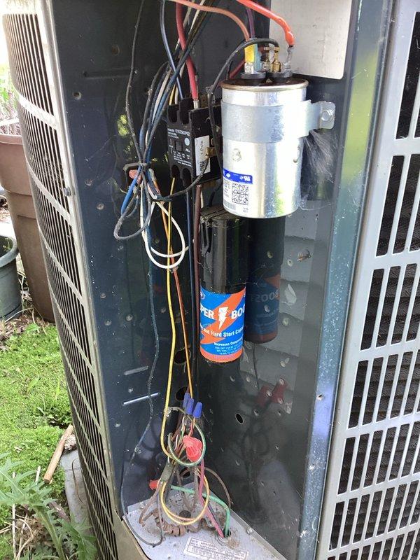 # HVAC Membership - A/C Maintenance Completed

Performed comprehensive planned maintenance on outdoor air conditioning condenser unit. Removed access panel to inspect internal electrical components including capacitor, contactor, and associated wiring connections. All electrical connections were verified secure with proper wire routing observed throughout the compartment. Capacitor tested and found operating within normal parameters. Contactor inspected for proper operation and contact wear.

Conducted visual inspection of condenser coils, noting typical environmental exposure and operational wear on unit surfaces. Exterior cabinet and fan assembly examined for structural integrity. Unit positioned on concrete pad with adequate clearance maintained. All safety covers and access panels reinstalled upon completion of maintenance procedures. System operational and functioning as designed per manufacturer specifications.