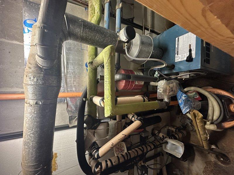 Responded to service call for hot water recirculation pump replacement. Upon arrival, performed comprehensive inspection of domestic hot water system and recirculation components in mechanical room. Evaluated existing pump installation, associated piping connections, and system configuration. Assessed copper piping, brass fittings, and shut-off valves serving the recirculation loop. Inspected condition of surrounding plumbing infrastructure including water heater connections and distribution piping. Documented current system layout and equipment condition through photographic documentation. Provided assessment of recirculation pump requirements and recommended options for replacement to restore proper hot water circulation throughout the residence.