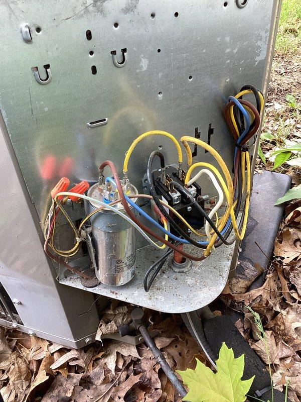 # HVAC Maintenance Completed

Performed planned preventive maintenance on outdoor air conditioning condensing unit. Inspected condenser coil fins and fan assembly through top guard, verified proper airflow around unit perimeter. Accessed service panel to check refrigerant line connections and service ports. Observed accumulation of leaves and debris around unit base that could restrict airflow. All refrigerant hoses and connections inspected for wear and proper installation. Unit operational at time of service visit.