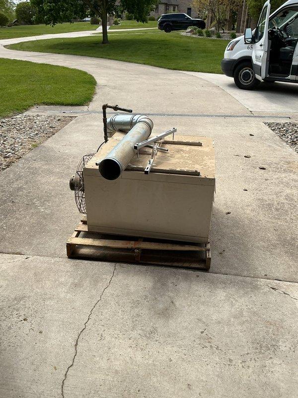 Removed unit heater from above horse stalls in barn structure and capped refrigerant lines. Unit was relocated to driveway for customer retention, and all penetrations were properly sealed to maintain building envelope integrity.