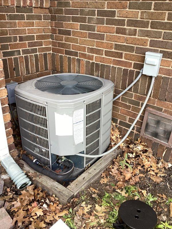 Completed planned air conditioning maintenance on residential outdoor condensing unit. Performed visual inspection of unit exterior, removed top access panel to inspect internal electrical components including capacitor, contactor, and wiring connections, and verified all components were functioning properly with no immediate repairs needed.