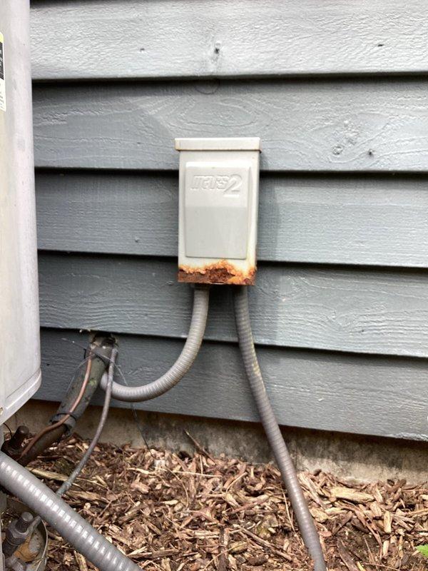 Completed scheduled air conditioning maintenance as part of membership plan service. Performed standard cooling system inspection and maintenance procedures on HVAC equipment. Documented existing rust and corrosion present on exterior electrical disconnect box, with significant deterioration noted at base of unit and conduit connections requiring future attention.