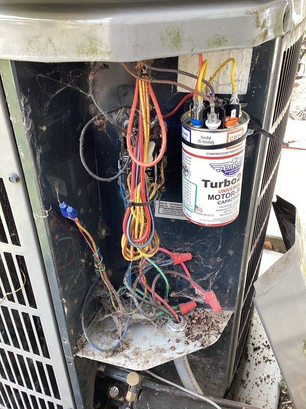 # HVAC Maintenance - Planned Single Maintenance

Completed scheduled air conditioning maintenance as part of membership plan, arriving within the requested early morning timeframe. Performed comprehensive system inspection of outdoor condenser unit, documenting equipment condition including aging Turbo capacitor with multiple wire connections, accumulated debris and cobwebbing in electrical compartment, and exterior housing showing weather-related deterioration with mold/mildew growth. Unit operational following standard maintenance protocol.