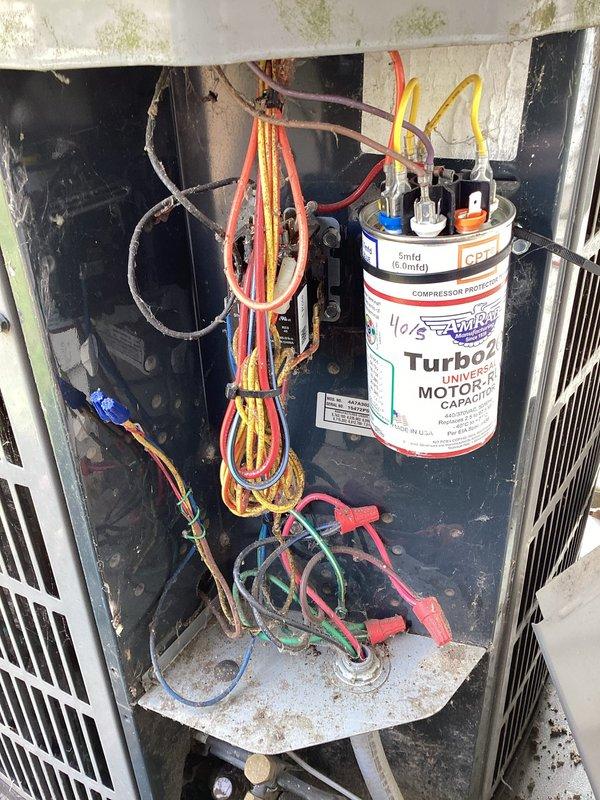 # HVAC Maintenance - Planned Single Maintenance

Completed scheduled air conditioning maintenance as part of membership plan, arriving within the requested early morning timeframe. Performed comprehensive system inspection of outdoor condenser unit, documenting equipment condition including aging Turbo capacitor with multiple wire connections, accumulated debris and cobwebbing in electrical compartment, and exterior housing showing weather-related deterioration with mold/mildew growth. Unit operational following standard maintenance protocol.