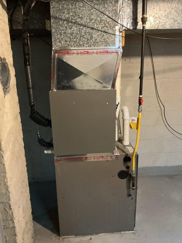 Completed installation of Lennox ML13KC1-024 condensing unit with CK40CT-30B cased coil and T4 thermostat at residential property. Connected new AC system to existing furnace, installed refrigerant lines, condensate drainage, and electrical wiring per manufacturer specifications. System tested and verified operational with proper airflow and refrigerant charge.