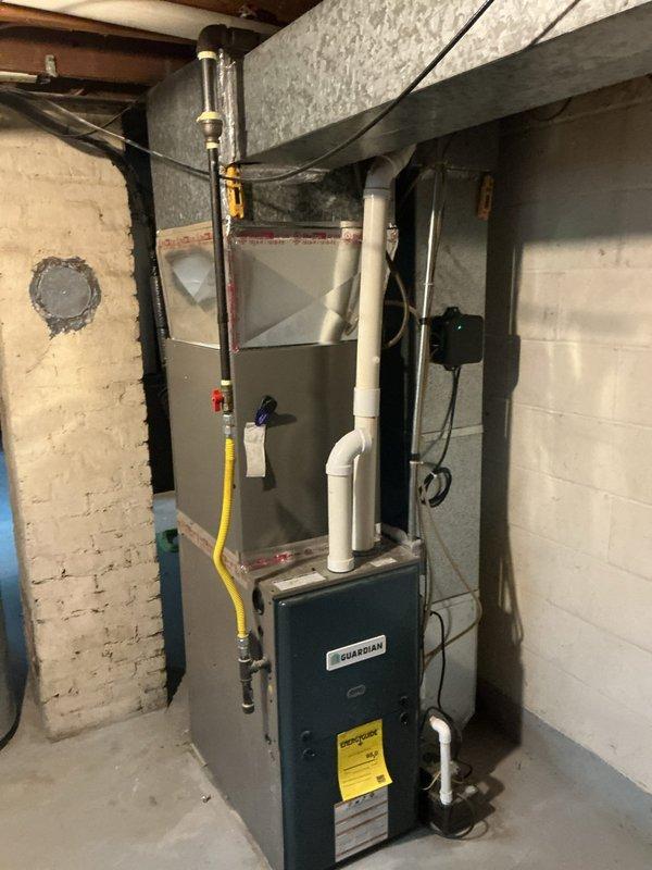 Completed installation of Lennox ML13KC1-024 condensing unit with CK40CT-30B cased coil and T4 thermostat at residential property. Connected new AC system to existing furnace, installed refrigerant lines, condensate drainage, and electrical wiring per manufacturer specifications. System tested and verified operational with proper airflow and refrigerant charge.