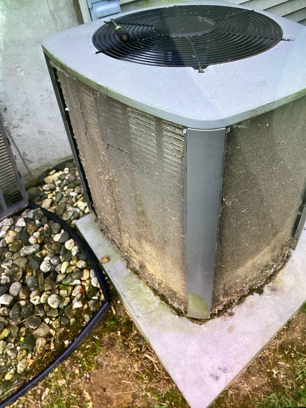 # HVAC Maintenance Completed

Performed planned air conditioning maintenance on outdoor condensing unit as part of recurring membership service. Inspected electrical control panel components including capacitor (marked 35/5 MFD), contactor, and associated wiring connections. Verified proper wire routing and terminal connections throughout control cabinet. Examined condenser coil condition through cabinet louvers and assessed overall unit operation. Documented equipment condition with photographs showing electrical components and exterior unit condition. Unit operational upon completion of maintenance inspection. Note: Filter service not included in this maintenance visit per service agreement terms.