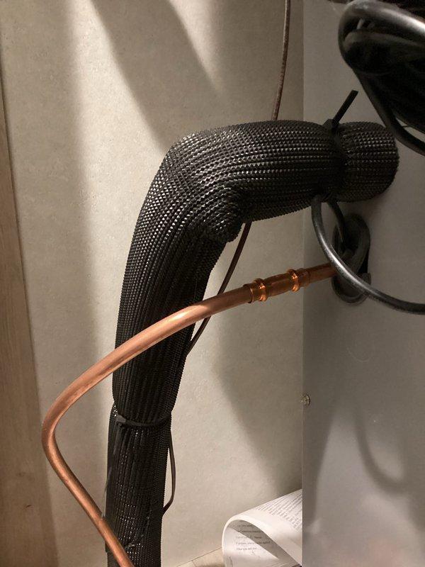 Responded to no cooling complaint on recently installed AC system. Upon arrival, performed system inspection and discovered refrigerant leak at flare connection on liquid line. Copper tubing showed improper installation with compromised flare fitting at outdoor unit connection point. Repaired flare connection, pressure tested system to verify leak repair, evacuated system to proper vacuum levels, and recharged unit to manufacturer specifications. Verified proper system operation with normal temperature differential across coil and adequate airflow. System restored to full cooling capacity.