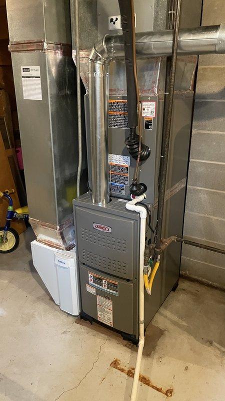 Completed full HVAC system installation in residential basement mechanical room, installing new Lennox ML180 high-efficiency gas furnace and Lennox ML13 air conditioning condenser unit on exterior pad. Connected all necessary ductwork, refrigerant lines, electrical wiring, and condensate drainage; reused existing thermostat per customer request. Verified proper system operation, airflow, and refrigerant charge; all equipment tested and functioning within manufacturer specifications.
