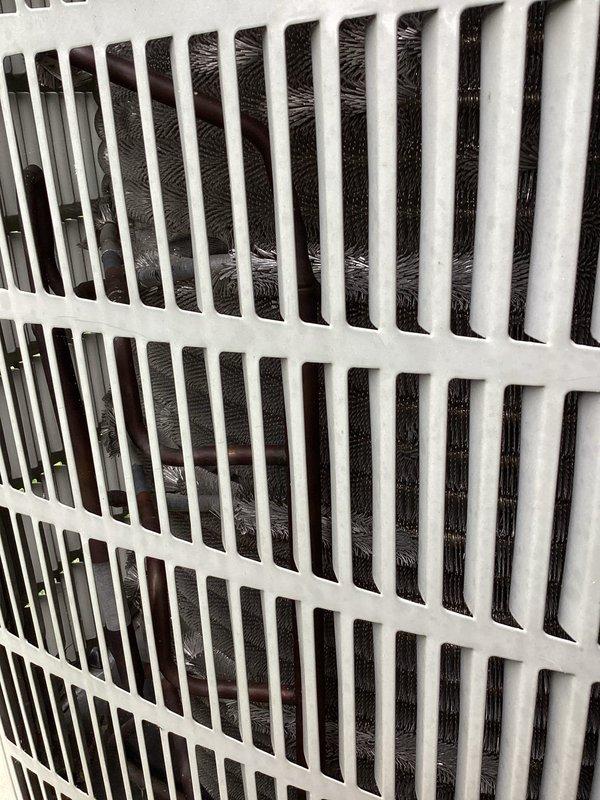 Completed comprehensive air conditioning maintenance per membership agreement. Inspected and photographed indoor air handler components including return air grille and filter media, confirming adequate airflow and filtration. Performed exterior condenser unit inspection, verifying proper installation on concrete pad with appropriate gravel drainage, checked refrigerant line insulation integrity, and confirmed all copper line connections and service valves were secure with no visible leaks. System operating within normal parameters upon completion.