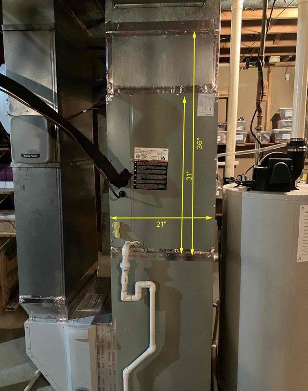 Conducted on-site evaluation of existing HVAC system in basement mechanical room for complete air conditioning replacement. Assessed current equipment configuration including furnace, air handler, and outdoor condensing unit compatibility. Documented equipment dimensions and clearances, measuring 36" height, 31" and 21" width specifications for replacement unit planning. Customer specifically requested quote for ML17KC2 non-communicating system with alternative options provided. Photographed existing installation layout including ductwork connections, PVC condensate drainage, electrical service panel, and available workspace. Evaluated mechanical room access, ceiling height clearances, and existing infrastructure to ensure proper sizing and installation feasibility for proposed replacement equipment.