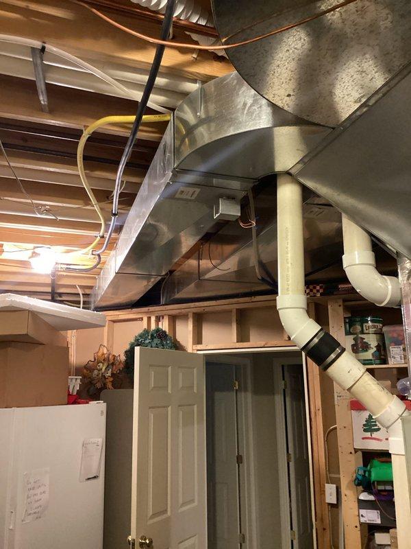 Completed annual first visit maintenance on residential split system HVAC unit as part of Gold Level planned maintenance program. Performed comprehensive inspection of outdoor condenser unit positioned on concrete pad and indoor air handler system located in basement. Inspected condenser coils, fan operation, refrigerant lines, and electrical connections on exterior unit. Evaluated indoor ductwork system, air handler components, and overall system performance. Verified proper operation of all mechanical and electrical components. Customer maintains their own filter replacements per established routine. System operating within normal parameters. Documentation completed with photographic records of equipment condition.