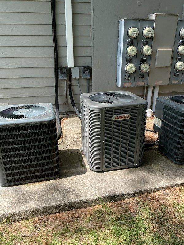 Completed installation of Lennox ML13KC1-024 outdoor condensing unit and ADP uncased evaporator coil. Recovered existing R-22 refrigerant from old system using recovery equipment prior to unit removal. Mounted new Lennox condenser on existing concrete pad alongside other HVAC units servicing the multi-unit building. Installed ADP uncased coil in air handler, made refrigerant line connections, and completed electrical hookup to existing meter bank. Reused existing thermostat to maintain customer's familiar control interface. System was pressure tested, evacuated, charged to manufacturer specifications, and tested for proper operation. All components functioning as designed with appropriate temperature differential across coil.