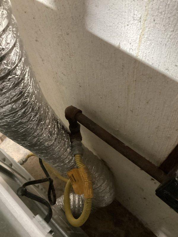 Responded to emergency gas leak at furnace valve on seven-year-old system. Utility company had already shut off gas supply to the unit prior to arrival. Performed visual inspection of gas piping, connections, and furnace valve assembly in mechanical room. Documented existing conditions with photographs showing gas line configuration, flexible gas connector, and surrounding HVAC components. System remains offline pending further leak isolation, repair, and pressure testing to verify safe operation before gas service restoration.