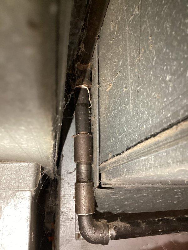 Responded to emergency gas leak at furnace valve on seven-year-old system. Utility company had already shut off gas supply to the unit prior to arrival. Performed visual inspection of gas piping, connections, and furnace valve assembly in mechanical room. Documented existing conditions with photographs showing gas line configuration, flexible gas connector, and surrounding HVAC components. System remains offline pending further leak isolation, repair, and pressure testing to verify safe operation before gas service restoration.