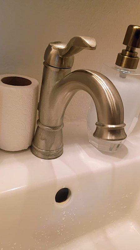 Completed Gold Level maintenance on single HVAC system as part of planned maintenance program. Upon arrival, customer requested additional evaluation of toilet flushing issue, which was acknowledged as an extra service beyond the standard HVAC maintenance scope. Documented bathroom plumbing fixtures including faucet and sink conditions with photographic evidence for service records.