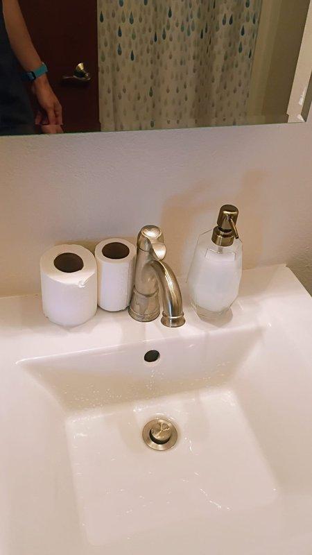 Completed Gold Level maintenance on single HVAC system as part of planned maintenance program. Upon arrival, customer requested additional evaluation of toilet flushing issue, which was acknowledged as an extra service beyond the standard HVAC maintenance scope. Documented bathroom plumbing fixtures including faucet and sink conditions with photographic evidence for service records.