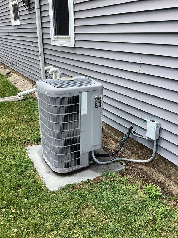 Completed planned HVAC maintenance on Carrier split system including indoor furnace/air handler unit and outdoor condensing unit. Performed comprehensive A/C maintenance inspection, replaced air filter per membership plan specifications, verified refrigerant line connections and electrical disconnect operation, and completed water heater service maintenance as part of membership agreement. All equipment photographed and found operating within normal parameters with proper clearances maintained at both indoor and outdoor installations.