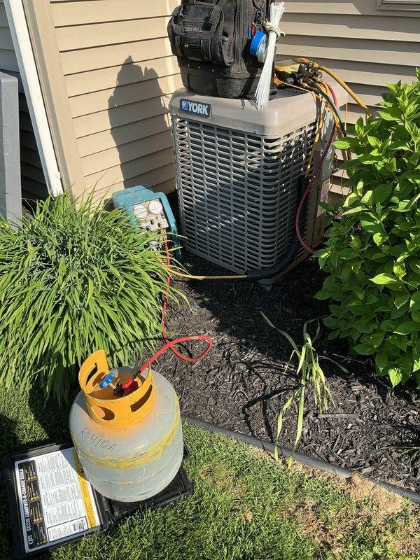 Completed full HVAC system installation including Lennox EL297UH070XV36BK furnace, ML17KC2-036-230 condenser unit, and CK40CT-36B-71 evaporator coil. Installed Aprilaire 1610 humidifier and Honeywell TH6220U2000 thermostat. Utilized locking cap tool to access service valves on existing condenser unit for proper refrigerant line connections. Performed refrigerant recovery and charging procedures using calibrated scale to ensure proper system charge. Connected all refrigerant lines, electrical wiring, and control circuits. Verified system operation and conducted startup procedures to confirm proper heating and cooling functionality.