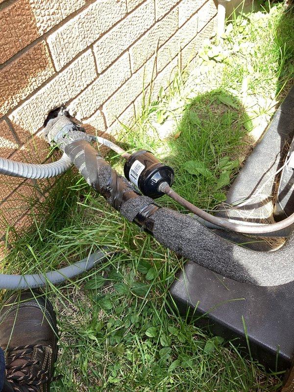 Completed scheduled air conditioning maintenance as part of HVAC membership plan within the promised 12-4pm service window. Performed comprehensive system inspection of outdoor condensing unit, including examination of refrigerant line set, associated copper piping, and condensate drainage components. All equipment photographed and documented showing proper installation and operational status of mechanical components.