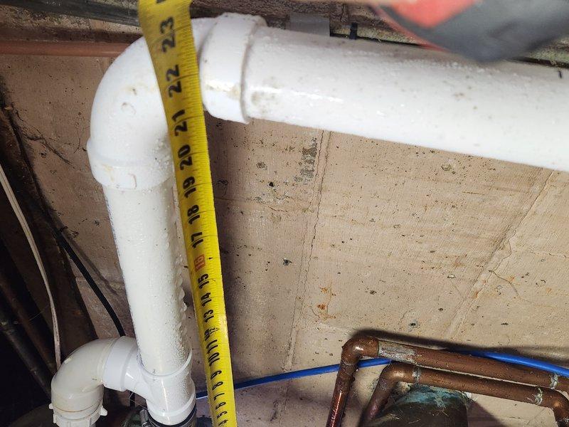 # Sump Pump System Evaluation and Service

Responded to ongoing basement flooding issue in 76-year-old residential property where sump pump system was failing to maintain water levels after several days of standing water accumulation. Upon arrival, performed comprehensive assessment of existing sump pump installation and discharge piping configuration.

Inspected primary sump pump assembly, basin, and associated plumbing components including PVC discharge lines and check valve operation. Evaluated pump motor performance, float switch functionality, and electrical connections. Examined copper and PVC piping infrastructure for proper drainage capacity and potential restrictions or blockages affecting system performance.

Documented existing conditions through photographic evidence showing pump basin setup, discharge piping arrangement with P-trap configuration, and overall mechanical space layout. Assessed adequacy of current pump capacity relative to water intrusion rate and basin size 