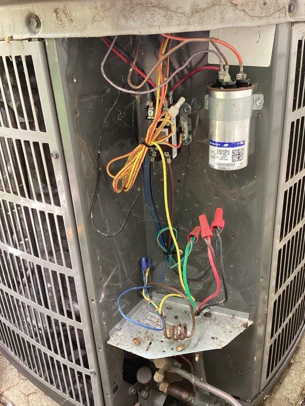 # HVAC Maintenance - Planned Single Maintenance

Completed comprehensive air conditioning maintenance service per membership agreement. Performed full system inspection with access panel removal to evaluate internal components and electrical connections. 

Conducted diagnostic testing of capacitor using test leads to verify proper capacitance values and electrical performance. Inspected all electrical wiring, including power supply connections, control circuits, and ground connections for signs of wear, damage, or loose terminals. All wire connections found secure with no evidence of overheating or deterioration.

Evaluated capacitor condition, including visual inspection for bulging, leaking, or corrosion on terminal connections. Component showing normal wear consistent with system age. Examined condenser coil and refrigerant lines for proper insulation and signs of refrigerant leaks. Copper refrigerant lines displaying normal oxidation consistent with outdoor installation and system 
