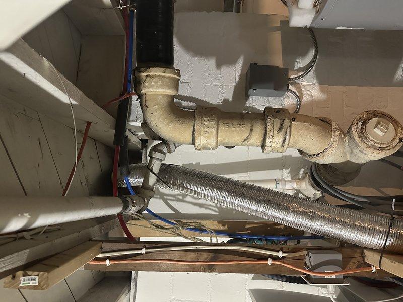 Responded to a main sewer line stoppage causing backup from the kitchen sink into the bathtub. Located and accessed the main cleanout in the basement utility area. Cleared the blockage in the main drain line using professional drain cleaning equipment. Verified proper drainage flow was restored throughout the plumbing system and confirmed no additional backups were occurring. Advised customer to discontinue use of chemical drain cleaners to prevent pipe damage and ensure safe working conditions for future service needs.