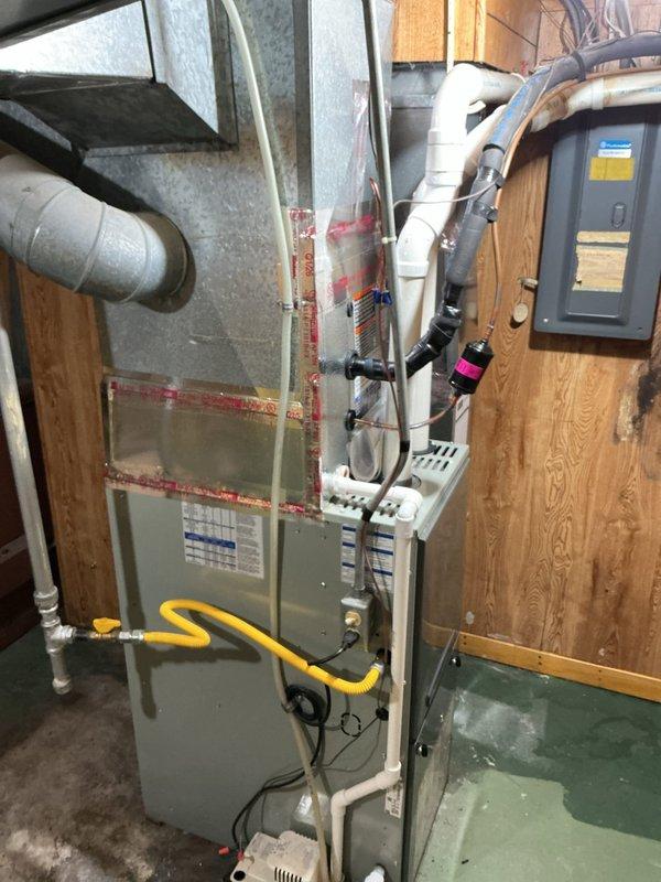 Completed installation of Lennox ML13KC1-030 air conditioning condenser unit with matching ADP evaporator coil, replacing existing HVAC system. System was installed on exterior pad, refrigerant lines were connected and insulated, electrical connections completed, and unit was charged with refrigerant to manufacturer specifications. Indoor coil was integrated with existing furnace, all connections were tested and verified operational, and system performance was confirmed using diagnostic gauges to ensure proper pressures and temperatures throughout the refrigeration cycle.