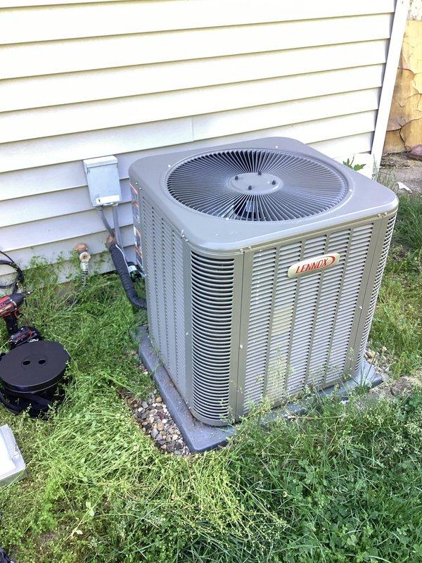 Completed planned air conditioning maintenance on Lennox outdoor condensing unit. Performed comprehensive system inspection including electrical connections, capacitor condition, and overall unit operation. Documented equipment condition with interior control panel and exterior unit photographs showing proper wiring configuration and satisfactory component status.