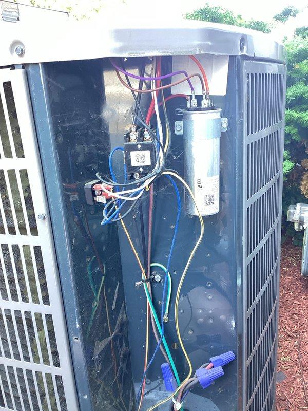 Completed scheduled cooling season maintenance on residential outdoor HVAC unit. Performed comprehensive system inspection including electrical connections, capacitor testing, and condenser coil examination. All components found operating within normal parameters, wiring connections secure, and unit functioning properly for continued cooling operation.