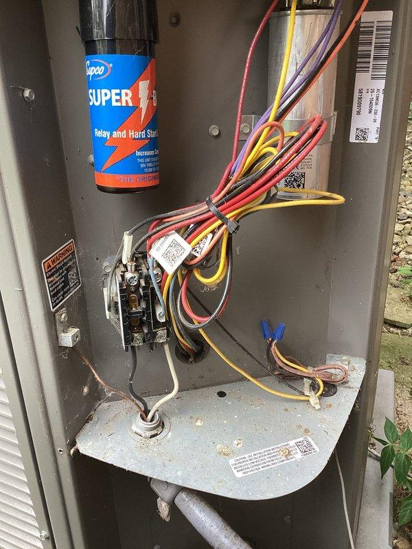 Completed planned air conditioning maintenance on outdoor condensing unit. Inspected electrical control panel components, contactor, and wiring connections. Applied capacitor start spray to relay and hard start components. Verified proper operation of condenser fan motor and grille assembly. Unit operating within normal parameters upon completion of scheduled maintenance service.