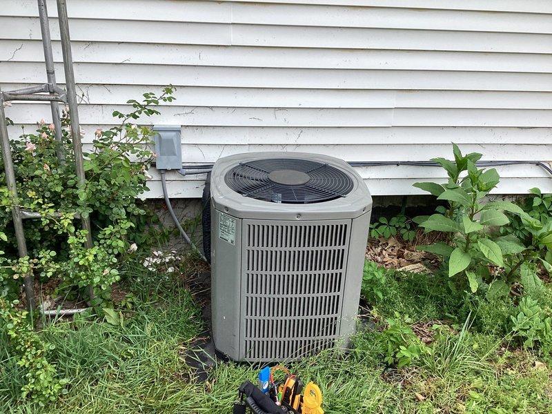 Completed monthly Gold Level planned maintenance on 29-year-old single system. Performed comprehensive inspection of outdoor condenser unit, including visual assessment of housing, fan assembly, and electrical connections. Cleared excessive vegetation growth surrounding unit to restore proper airflow clearance and prevent future obstruction of cooling components. Documented system condition with photographs showing unit positioned against building exterior with overgrown grass and climbing vines requiring attention for optimal equipment performance.